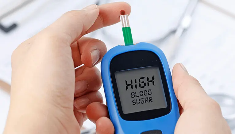 A glucometer showing a high blood sugar reading, a critical tool used in high sugar emergency treatment to monitor glucose levels.